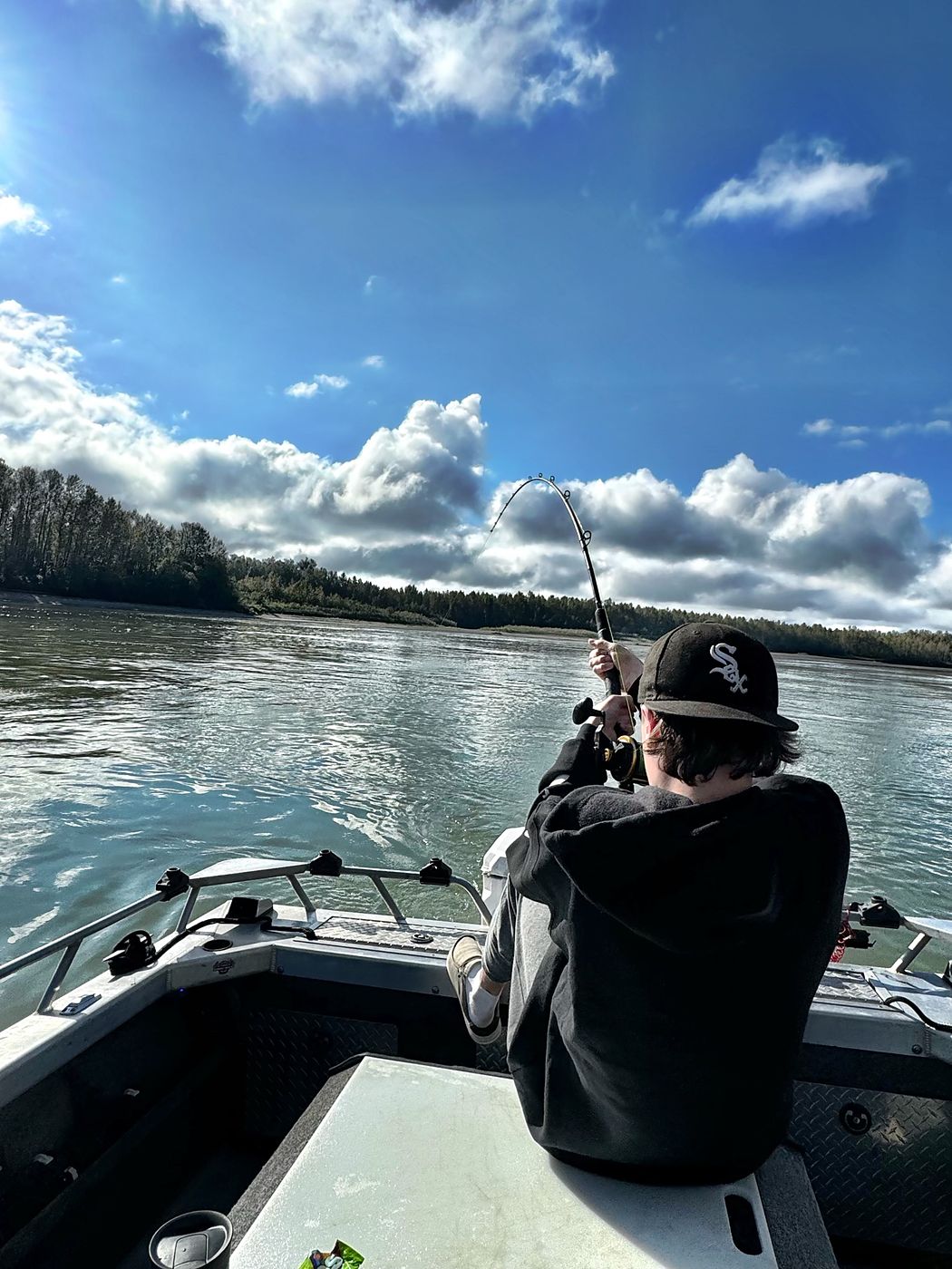 Fishing from the boat under Okanagan skies